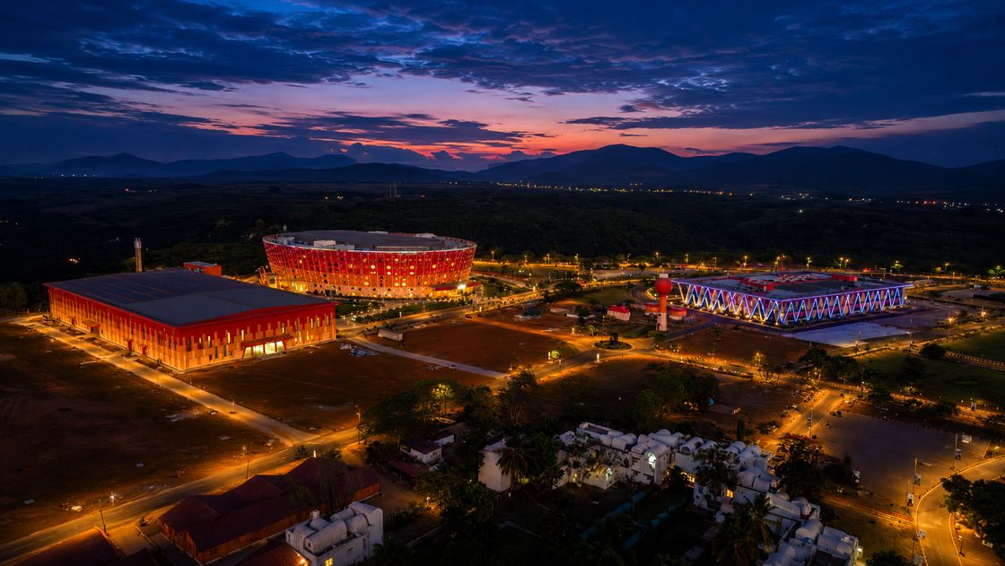 The UBCC campus illuminated across the landscape at dusk